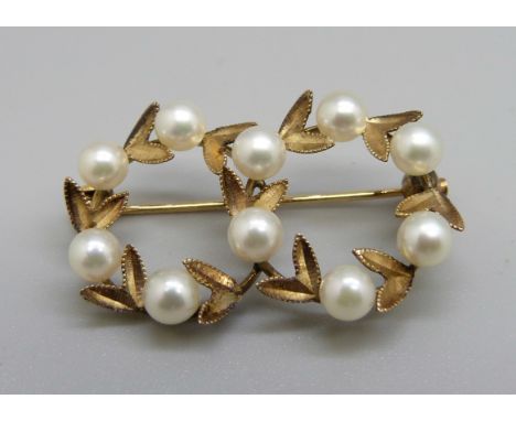 A Chinese yellow metal and pearl brooch marked K14, boxed, 3.7g 