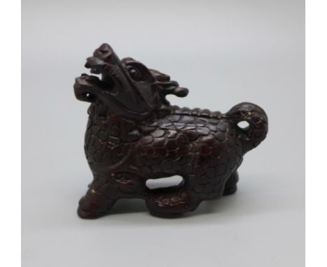 An ironwood dog of foe netsuke 