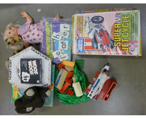 An Evel Knievel Super Jet, Subbuteo teams, a Japan made soft toy dog, games, etc. 