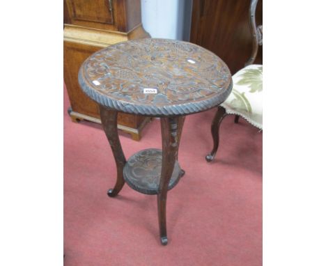 A XX Century Oriental Carved Circular Table, with a carved dragon gadrooned edge, on cabriole legs, with under shelf, 70cm hi