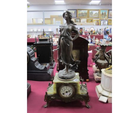 A French Green Marble Mantle Clock, surmounted with a speltre figure of a lady holding a scythe, the cream enamel dial painte