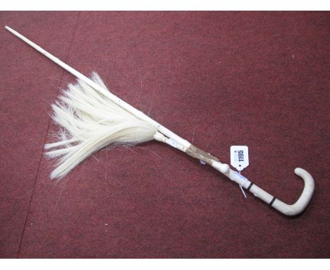 A Late XIX Century Ivory Walking Cane and Matching Fly Whip with Horse Hair, each carved in the form of a branch and arrow he