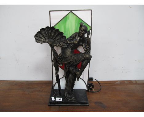 A Modern Reproduction Art Deco Style Lamp, featuring a bronzed effect dancing lady with fan in front of a coloured leaded gla
