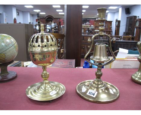 A Late XIX Century Brass Tavern Bell Candlestick, raised on a circular base, 29cm high; A Brass Incense Bowl, with pierced hi
