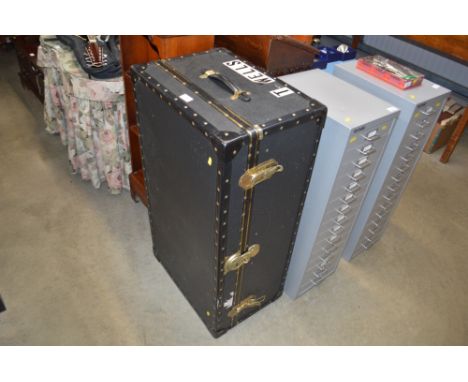 A leather bound travelling trunk