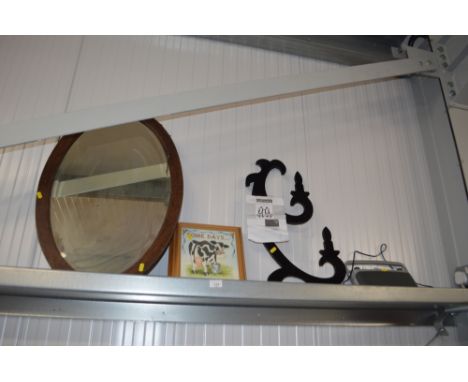 An oak framed bevel edged mirror together with a light fitting and various prints