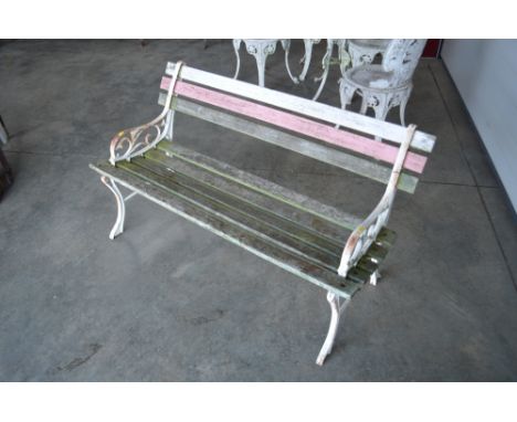 A wooden and metal children's garden bench