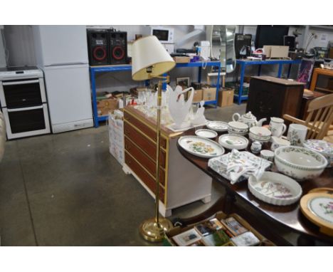 A brass standard lamp and shade