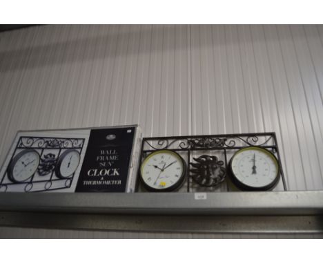 A wall framed sun clock and thermometer