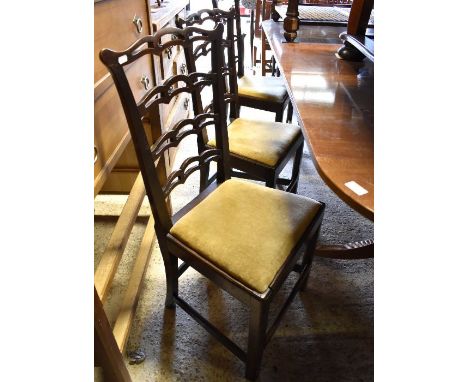 Four 19th century mahogany Chippendale style dining chairs with fret cut ladder backs and pad seats (4)