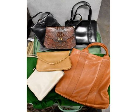 Green Samonsite suitcase containing four various vintage handbags