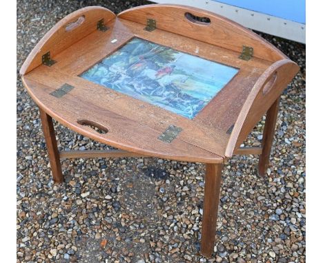 A vintage tile inset butlers tray coffee table, the tiles with hunting theme