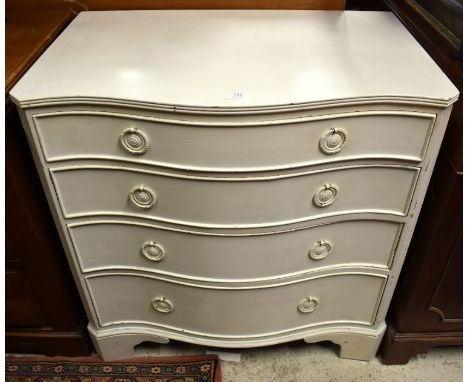 A cream painted serpentine front chest of four long drawers on bracket feet, 76 cm wide x 50 cm deep x 76 cm high