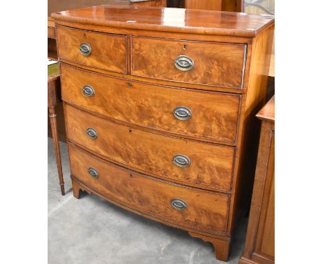 A 19th century mahogany bowfront chest of two short over three long drawers with replacement brass handles, raised on shaped 