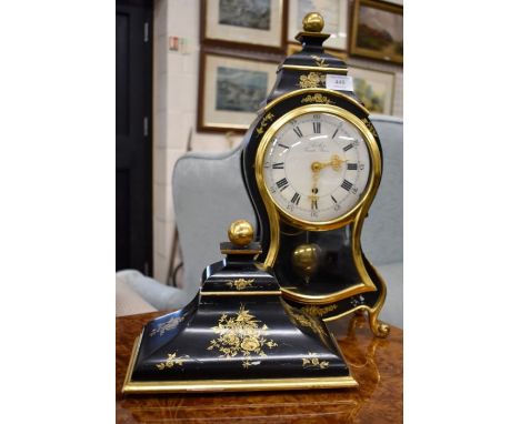 An early 20th century bracket clock by Turlev Zurich-Bern, black painted case with gilded floral sprays and glazed door, 45 c