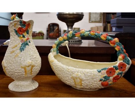 Art Deco Clarice Cliff Celtic Harvest fruit basket, 23 cm high and matching jug, 29 cm (repaired handle) (2)