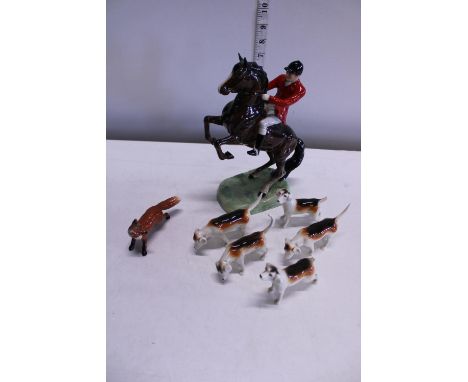 A vintage Beswick hunting scene group (damage to two dogs and nibble to foxes ear) 