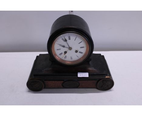 A early 20th century mahogany mantle clock with key and pendulum