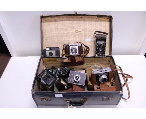 A vintage suitcase and contents of vintage cameras, shipping unavailable 