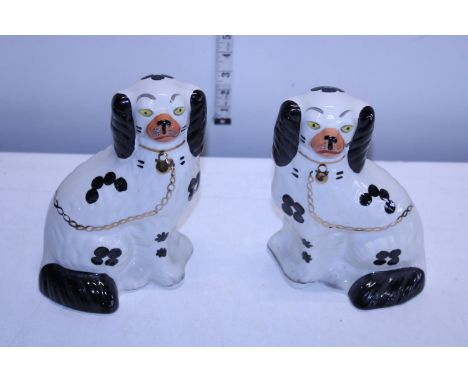 A pair of vintage Staffordshire flatback spaniels 