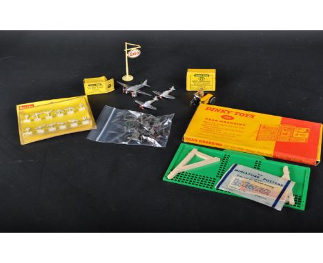 A collection of original vintage Dinky Toys diecast and plastic models, figures and accessory pieces to include; 603 Army Per