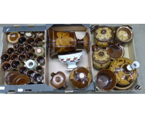 A large collection of Skegness pottery, includes a large urn, table lamp, flagon, oven wares, vase, etc. **PLEASE NOTE THIS L