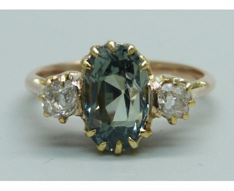 A yellow metal, diamond and green stone ring, (tests as gold), 2.8g, K 