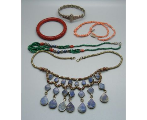 A malachite, coral and lapis necklace, a cinnabar bangle and a lapis necklace, etc. 