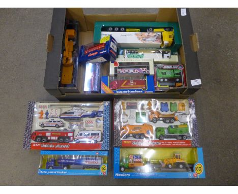 A box of die-cast model vehicles including Corgi trucks and lorries, boxed 