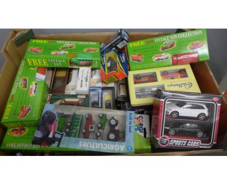 A collection of die-cast model vehicles including Burago and Corgi, boxed 