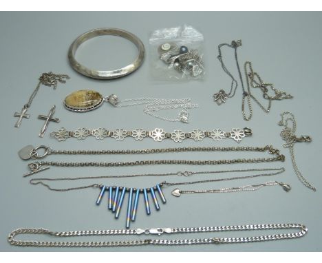 Eight silver necklaces, a , two bracelets, one a/f,  silver bangle, a cross pendant and a collection of odd silver earrings 