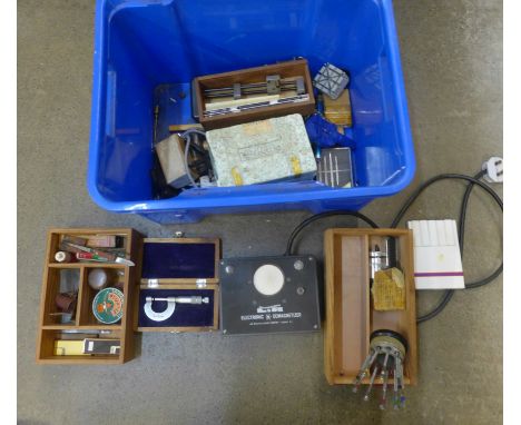 Watchmaker's tools:- an electronic demagnitiser, bushing tool, boxed, digital calipers, vice, two jars, screwdrivers, etc. 