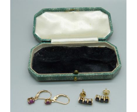 A pair of ruby earrings and a pair of sapphire earrings, both pairs set in silver gilt 