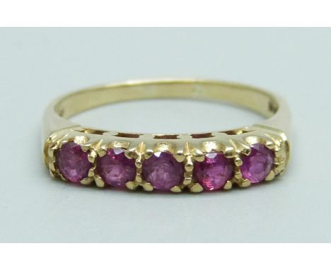 A 9ct gold and five stone ruby ring, 2.1g, M 