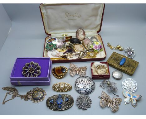 A collection of vintage brooches and a blue stone set case 