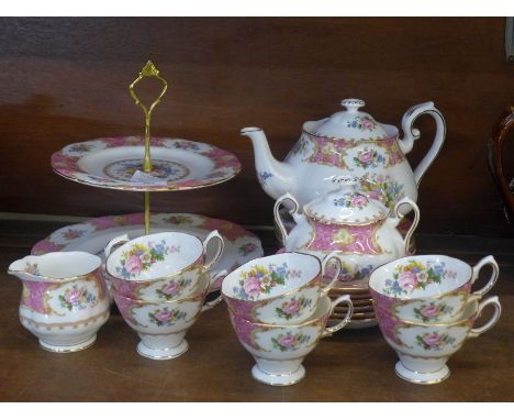 A Royal Albert Lady Carlyle six setting tea service, six cups, saucers, side plates, teapot, sugar and cream and a cake plate