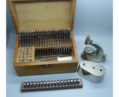 Watchmaker's tools:- a Favourite watch staking set, cased, and a set of roll-formers 