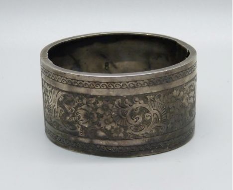 A Victorian silver bangle, dented, 36g 