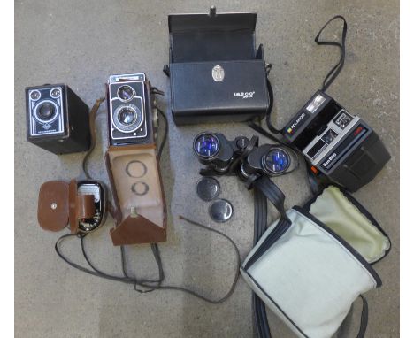 A pair of Tasco 6x18x35 binoculars, a Zeiss Ikon Ikoflex camera, a Weston Master II light meter, an Agfa box camera and a Pol