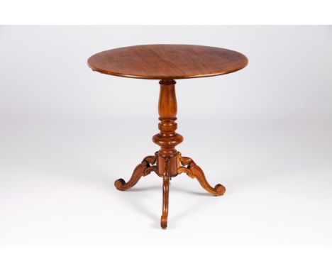 A tripod tableMahoganyCarved shaft and feetPortugal, 19th century70x75 cm