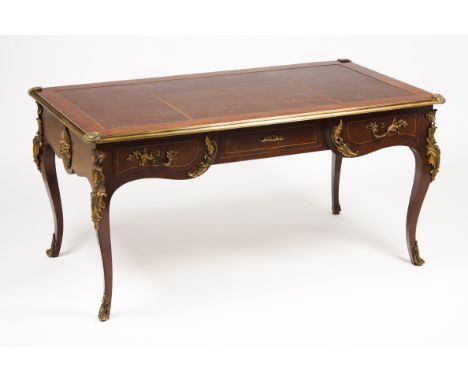 A Louis XV bureau platRosewoodWith two drawersRed leather lined topGilt bronze frieze and mounts75x153x83 cm