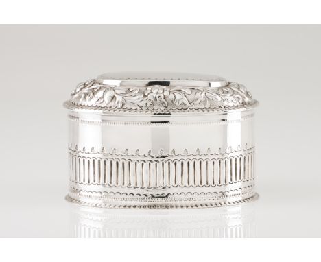 A tea caddy Portuguese silverOval shaped body of vertical grooved band and cover of raised foliage decorative motifsEagle hal