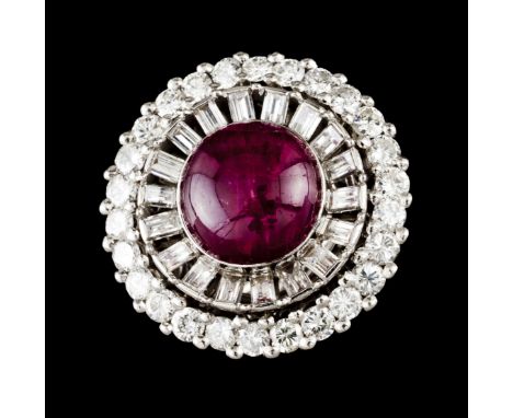 A ringPlatinum and white goldCircular shaped set with one cabochon ruby (diam.:10,8mm) 26 brilliant cut diamonds totalling (c