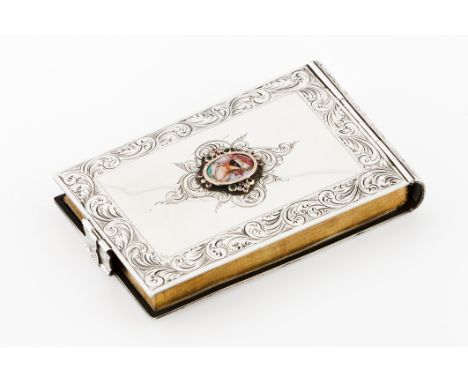 A notepadSilver coveredFront and back of chiselled frame with enamelled ceramic applied medallion depicting a masked lady set