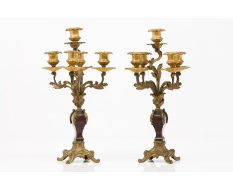 A pair of Napoleon III five branch candelabraGilt bronzeSquare shaped tortoiseshell and gilt bronze column shaftsFrance, 19th