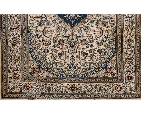 A Nain rugWool and cottonBlue and beige shades of floral pattern and central medallion(light wear)383x294 cm