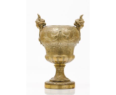 A Napoleon III vaseGilt and chiselled bronze of foliage and floral decorationEffigy handlesFrance, 20th centuryHeight: 30 cm 