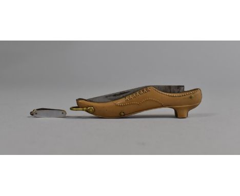 A Vintage Novelty Folding Pocket Knife in the Form of a Ladies Shoe together with a Miniature Folding Knife Charm with Mother