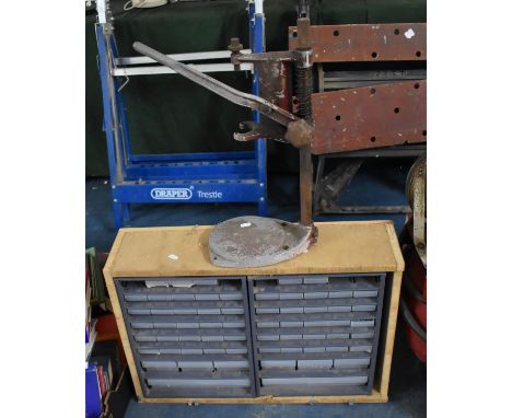 A Tool Store Containing Various Tools and Nuts together with a Tooling Item 