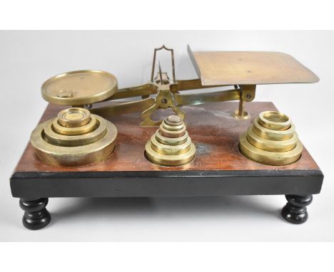 A Large Victorian Set of Brass Postage Scales, The Mahogany Plinth Base Set with Graduated Brass Weights, 38cms by 22cms 